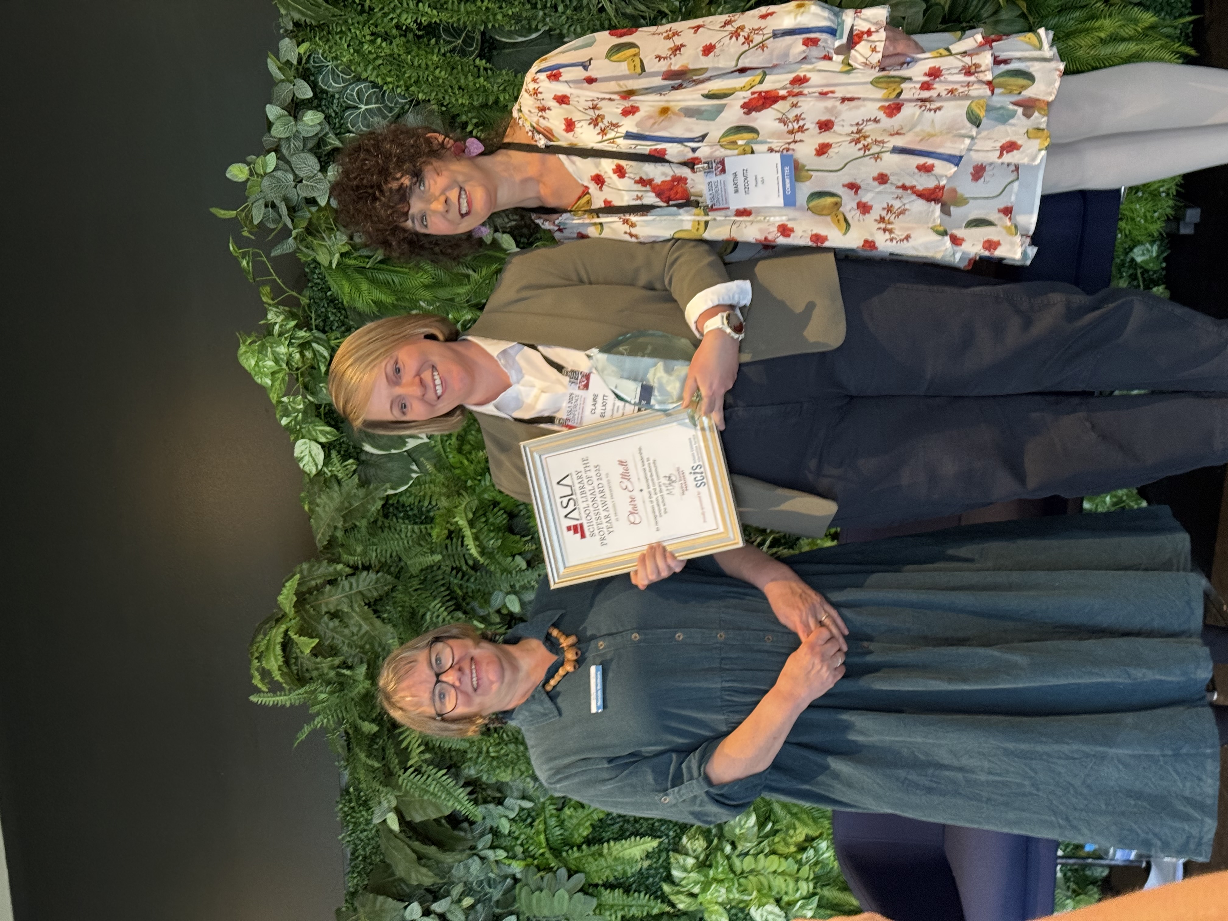 A picture of Claire Elliot holding her award certificate, standing between Renate Beilharz from SCIS and Martha Itzcovitz from ASLA