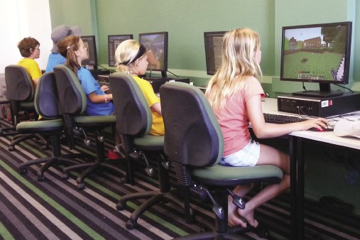 Students using the computers in the library