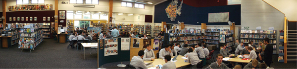 Library full of students studying at desks