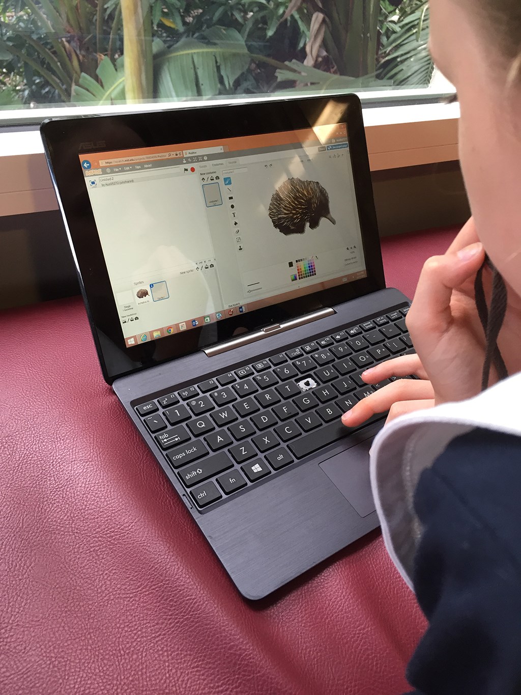 Student using a laptop to learn coding