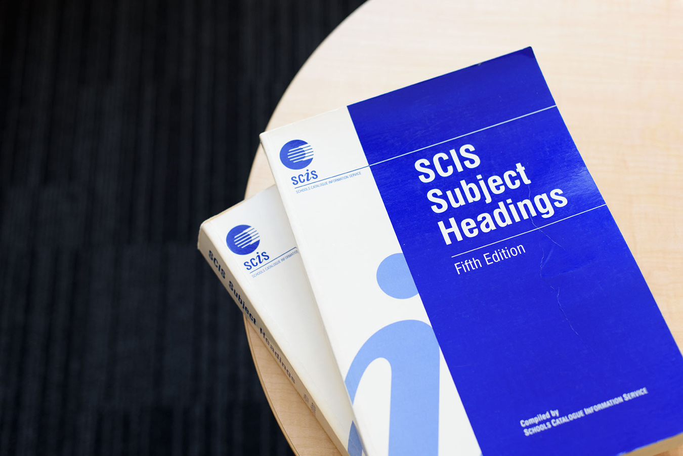 Two copies of SCIS Subject Heading: Fifth Edition on a table.