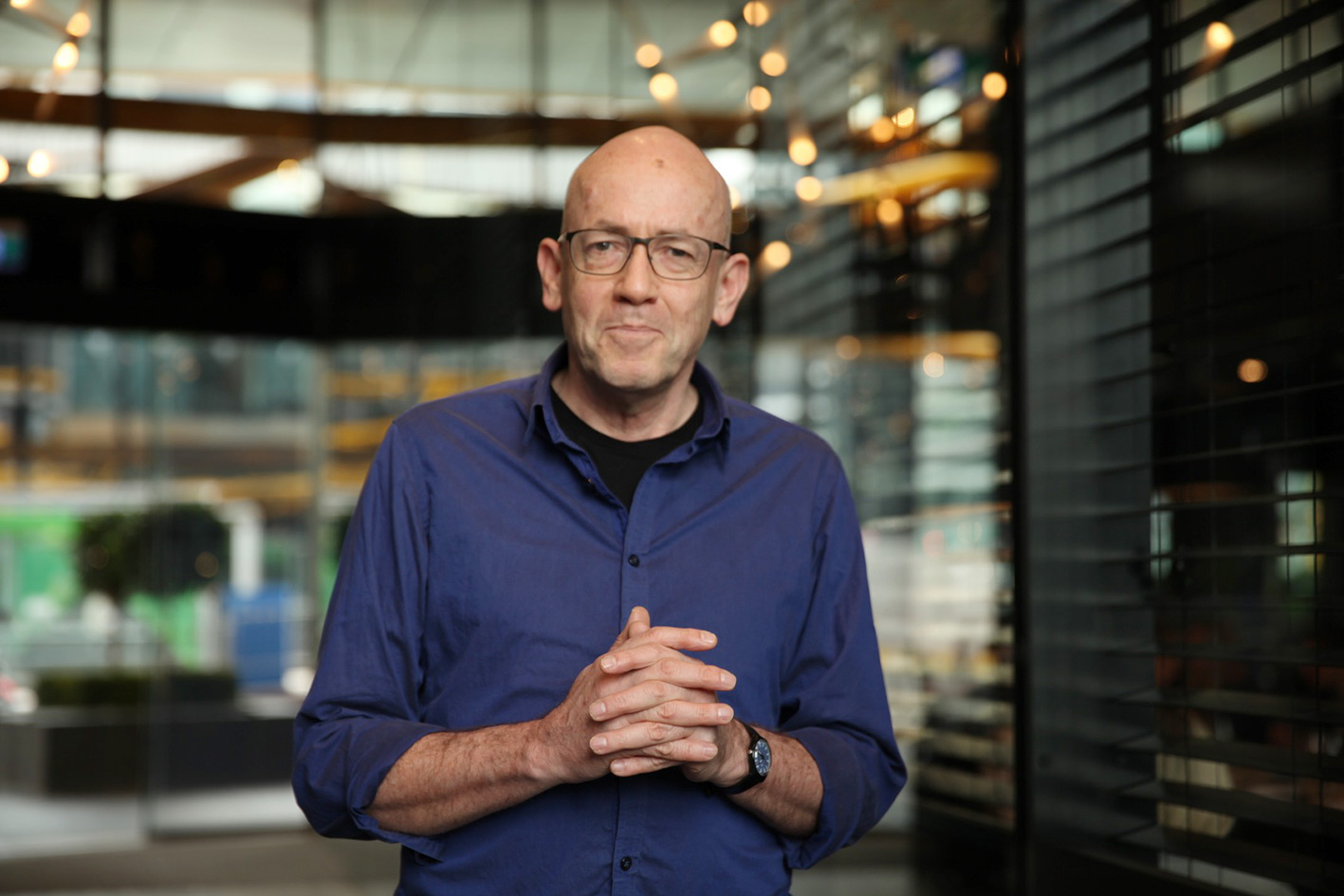 Morris Gleitzman wearing a blue shirt