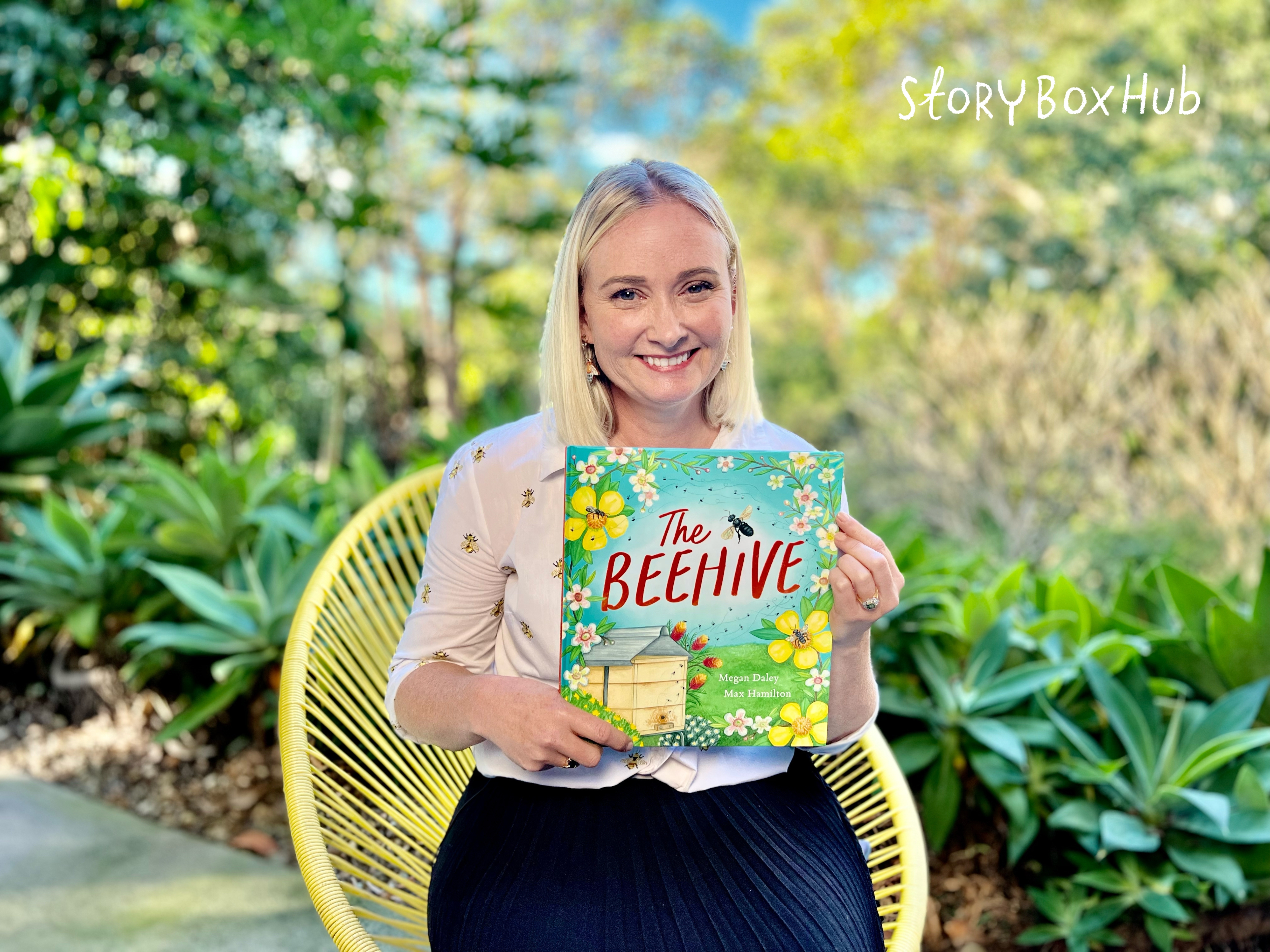 Megan Daley holding her book 'The Beehive'