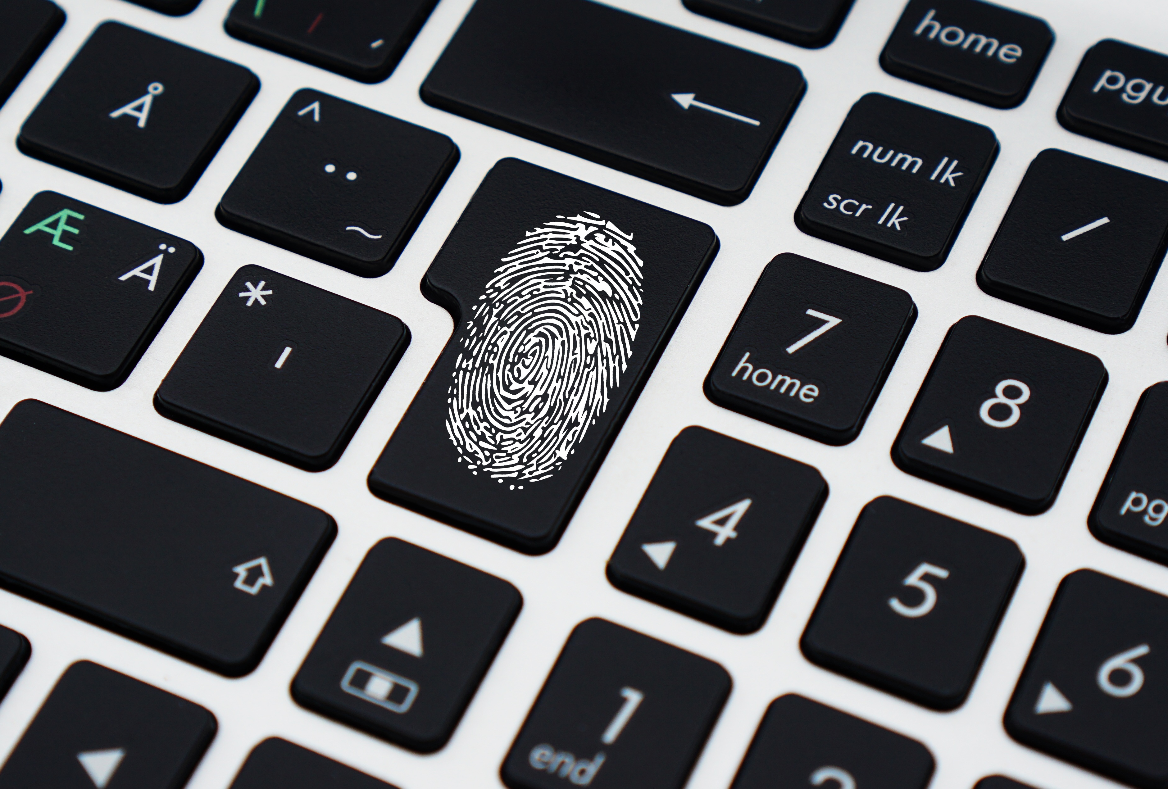 Computer keyboard with fingerprint, representing secure access