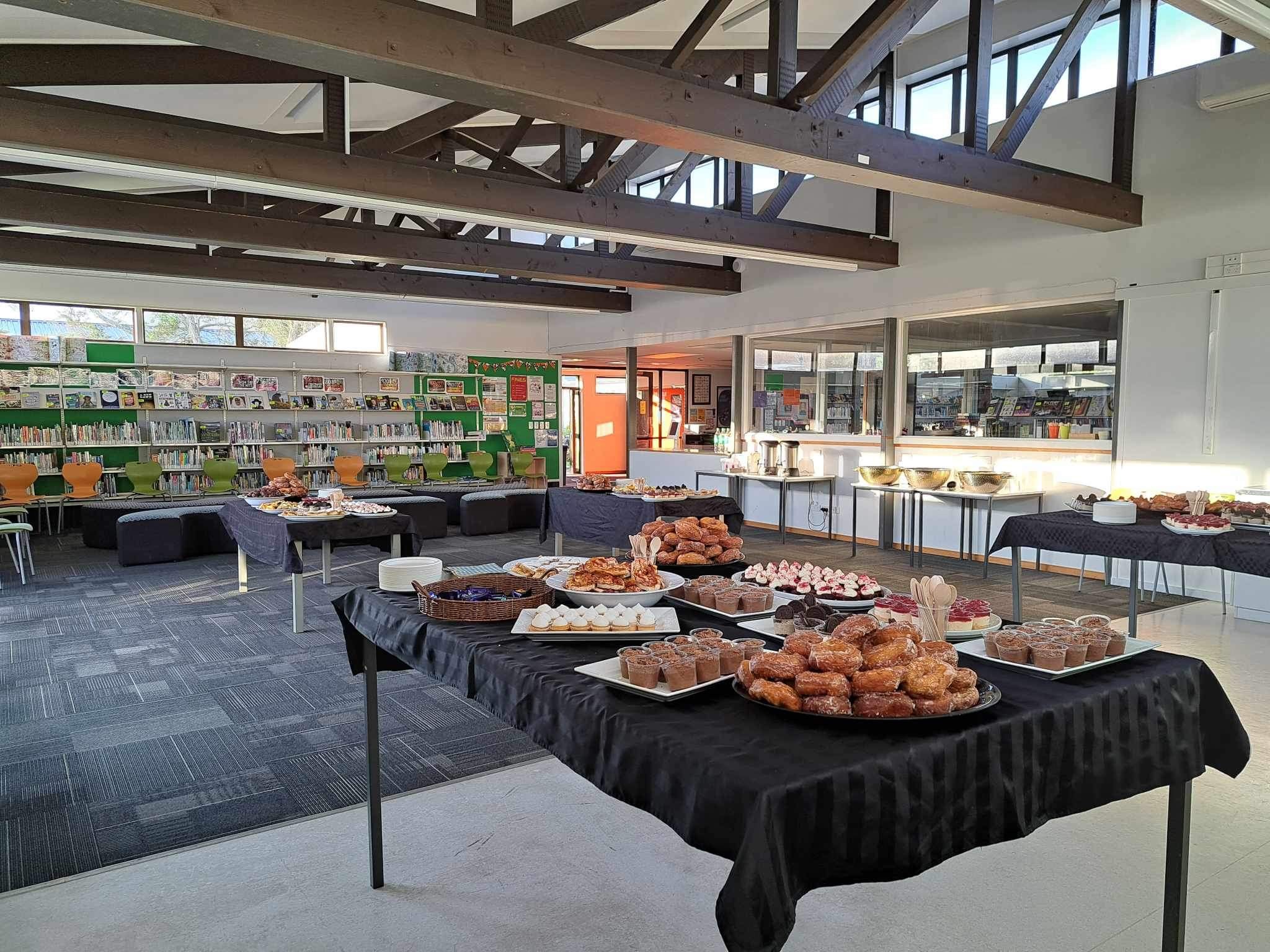 A table with morning tea food laid out on platters